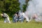 Firing a cannon at a War of 1812 re-enactment