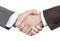 A firm handshake. Business partners shake hands. People in business suits make a handshake close-up isolated on white background.