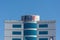 First Abu Dhabi FAB Bank blue logo on large building top on a blue sky sunny day