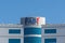 First Abu Dhabi FAB Bank blue logo on large building top on a blue sky sunny day