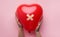 First Aid Band Plaster Strip Medical Patch glued on red heart balloon