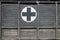 First Aid Black Cross on Wood on Old Retro Ambulance Car