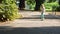 First attempts at skateboarding. Girl pushing one foot against the ground.