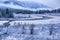 First autumn snow and the river in mountains