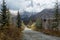 First autumn snow and rural road in mountains