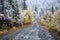 First autumn snow and rural road in mountains