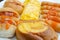 First Breakfast with Sausage, bread,egg on white plate in the morning time,close-up view.