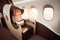 first-class seat in airplane, with plush leather seats and luxurious amenities