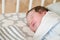 First day of the child at home. Newborn baby sleep first days of life. Cute little newborn child sleeping peacefully