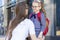 First day in the fall. back to school kids. mother lead little schoolgirl in uniform, schoolbag in the first grade.