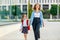 First day at school. mother leads  little child girl in grade