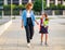 First day at school. mother leads  little child girl in grade