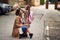 First day of school is over, parent playing with her schoolgirl