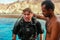 First dive in Red Sea near Aqaba resort in Jordan. Young scuba diver in equipment with instructor