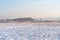 The first frosts in the forest at dawn, the grass and field are covered with hoarfrost