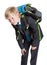 First grade pupil in uniform with heavy schoolbag, blond Caucasian boy, isolated white background