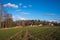 The first green winter shoots of agricultural crops sprung up in the fields. Countryside in Sweden.