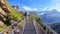 First, Grindelwald, Switzerland - August 16, 2019: Walking on the First Cliff Walk, observation platform over the Swiss Alps