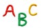 The first letters of the Latin alphabet fashioned from colored plasticine