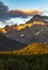 first light an a summer day shines on the jagged peak mountains of Glacier national park during summer