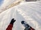 First person perspective of a snowboarder looking down the mountain