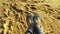 First-person view of a girl riding a swing overlooking a sandy tropical beach. Enjoying oceanfront relaxation and sunset