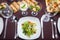 A first person view, a man is dining in the restaurant, a salad