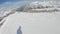 First-person view snowboarder on snowboard running down the slope in Ski resort. Winter sport and recreation, leisure