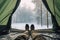 First person view from tent camping in snow covered wild field. Winter seasonal concept.