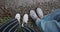 First person view of two females feet on the rocky beach. Girls carefree walking along the coast of river during thier