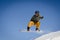 First plane of a snowboarder jumping in a sunny day in Aspen ski resort, United States