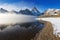 First snow. Mount Assiniboine, also known as Assiniboine Mountain, is a pyramidal peak mountain located on the Great Divide.