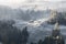 First snow on the slope of Seiser Alm plateau covered with morning mist. South Tyrol, Italy