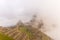 First soft light on Machu Picchu from opening clouds