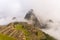 First soft light on Machu Picchu from opening clouds