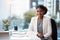 The first step to succeeding is showing up. Portrait of a confident young businesswoman working at her desk in a modern