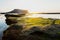 First sunrays at sunrise at Ilchulbong volcano crater, Seongsan, Jeju Island, South Korea