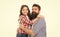 The first true love a girl has is her dad. Happy dad and adorable little daughter hugging and smiling. Bearded dad and