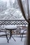 The first white fluffy snow on the table and chairs on the wrought-iron balcony. Fabulous winter