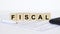 Fiscal word concept written on wooden cubes blocks