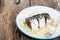 Fish appetizer: slices marinated mackerel.