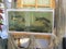 Fish aquarium and fishing nets used as peasant`s house decorations imitating authentic Russian countryside life. Rustic scene