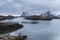 Fish basin in the nordic sea with snowy mountains of the Lofoten islands