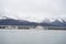 Fish boat and a Coast Guard ship parked in Seward Alaska Harbor.