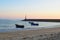 fish boats and lighthouse in Praia dÂ´Aguda beach