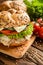 Fish burger with mackerel meat, cheese and fresh vegetable