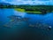 a fish cage in a blue lake