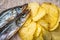 Fish and chips. Dried fish and fluted chips, a beer snack. Top view. Selective focus