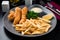 Fish and Chips English cuisine fried cod in batter with French fries and tartar sauce is a traditional snack