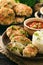 Fish cutlets with broccoli served with boiled rice.